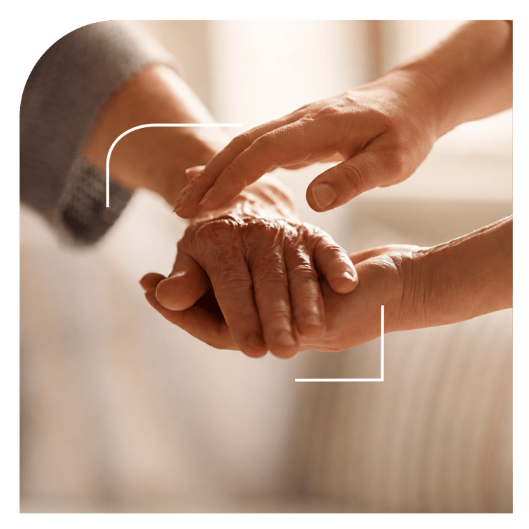 A person holding another person’s hands